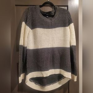 Gray and cream colored sweater